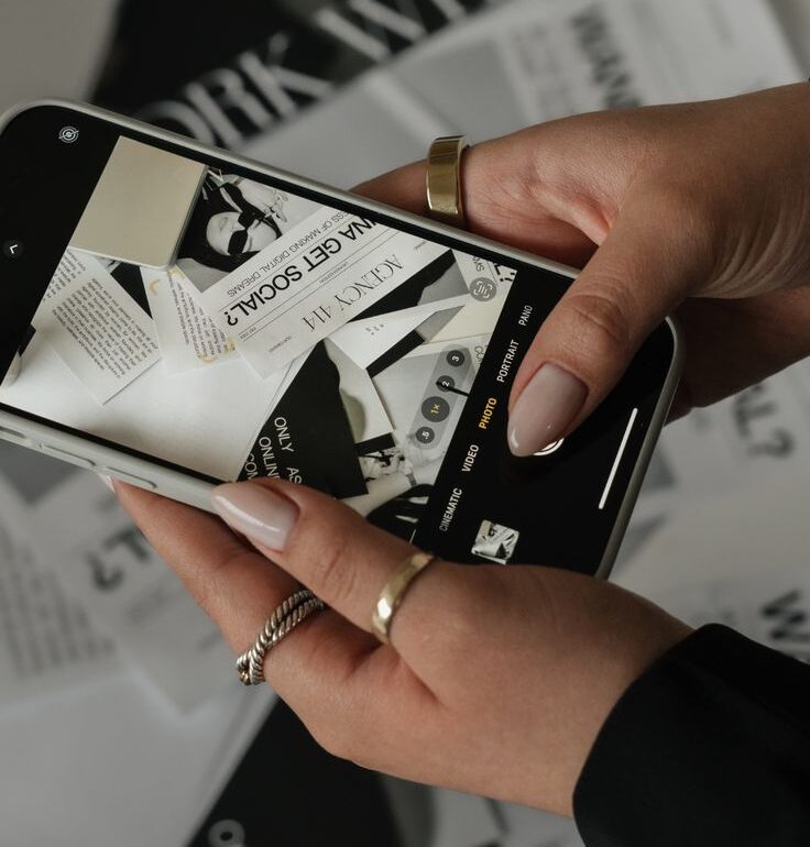 This image is about digital marketing—a phone where you take images to use for social media content and instagram reels.